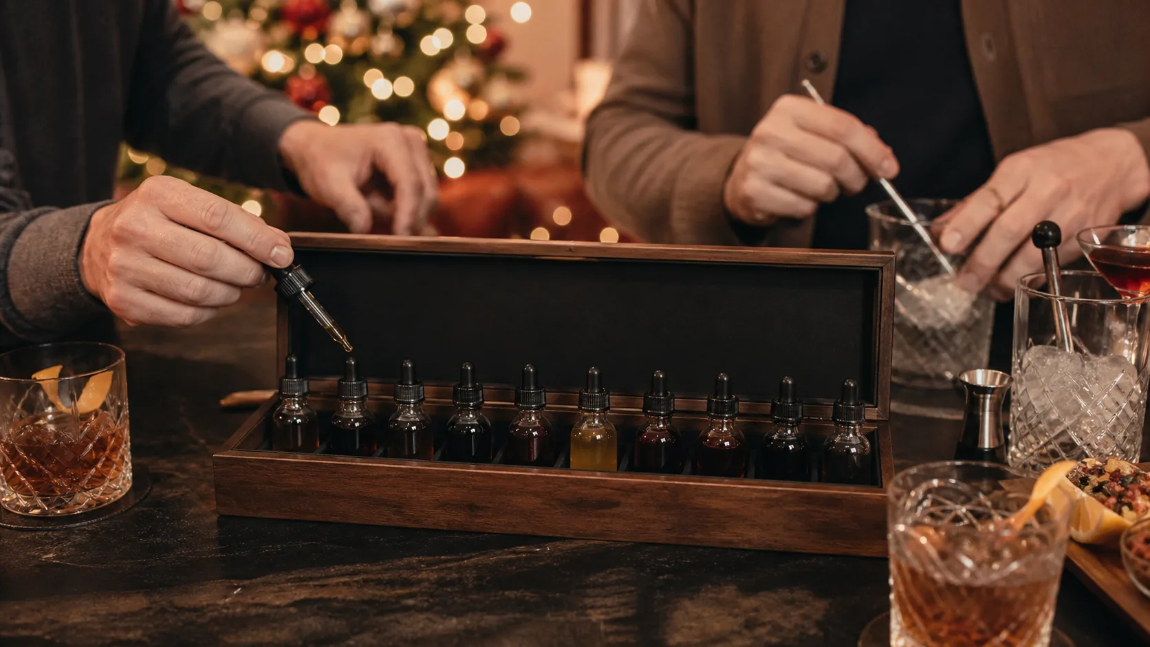 Representative row of small dasher bottles of assorted cocktail bitters